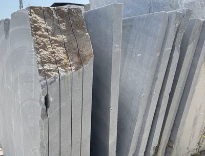 Sawn stone block with the slabs still standing in the cut