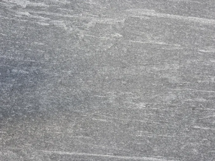 Flamed gray stone surface texture, full frame