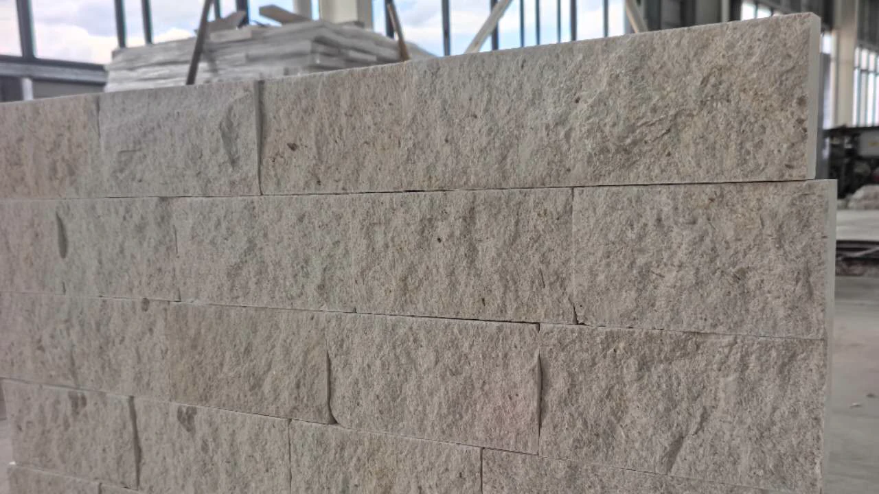 Split-face stone wall mockup assembled in the workshop to review coursing and surface response