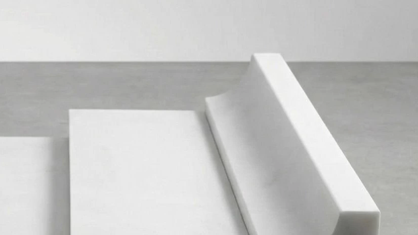 White marble cove molding profile produced as a mockup to check edge geometry