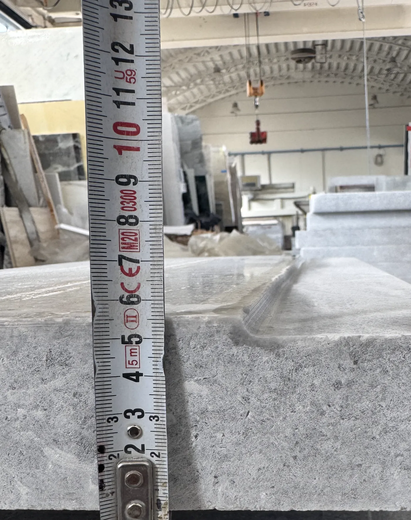 Folding rule checking the thickness of a coping piece